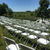 Outdoor wedding at HighPoint City Church with white chairs