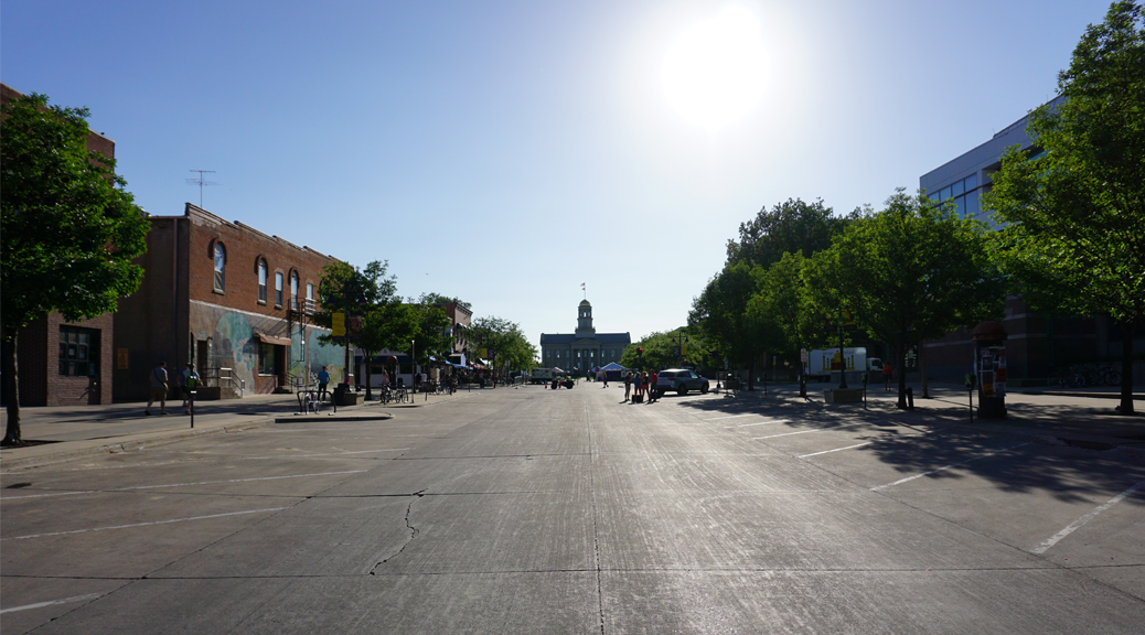 Photo of Old Capital Building with streets empty for the setup of the 2016 Iowa Arts Festival by Big Ten Rentals