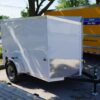 Right side of 5' x 8' white single axle enclosed trailer for rent or sale sn2643