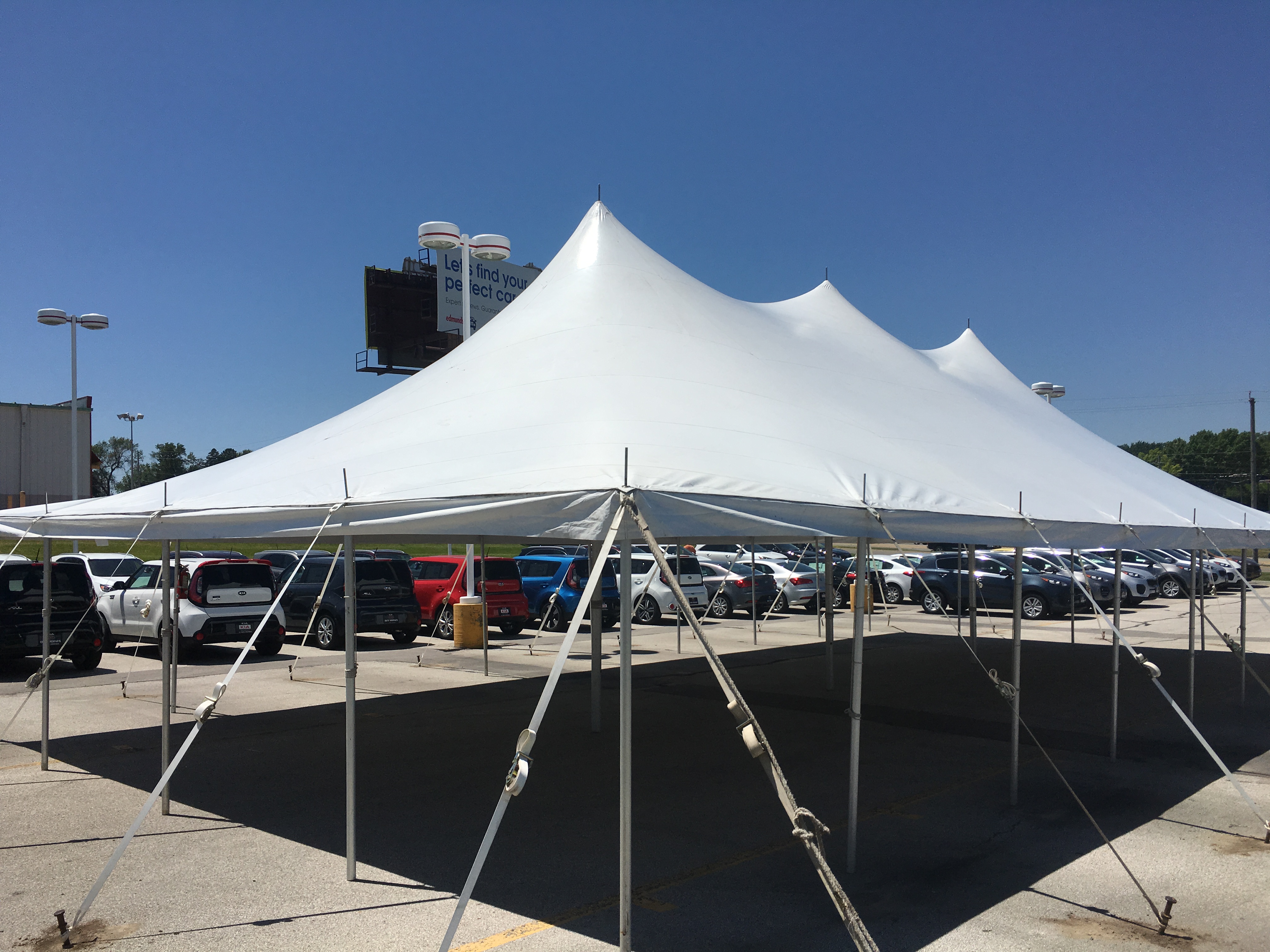 Rope and pole tent at dealership tent sale