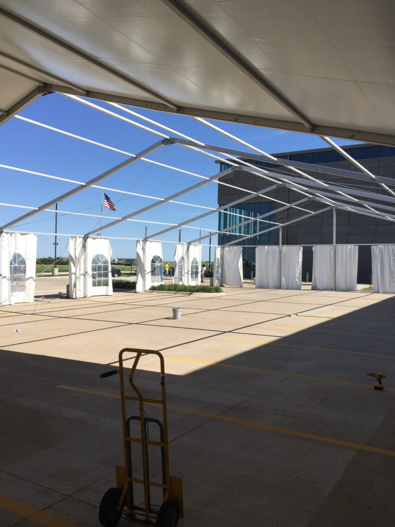 Setting up 60' x 131' clearspan Losberger tent at brownells in Grinnell, Iowa