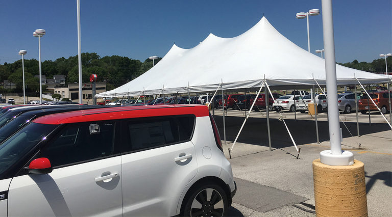 Tent sale setup for Kia Motors car dealership in Des Moines, Iowa