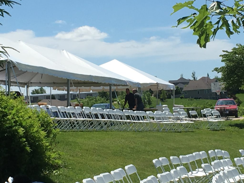 Tents and chairs at an outdoor wedding