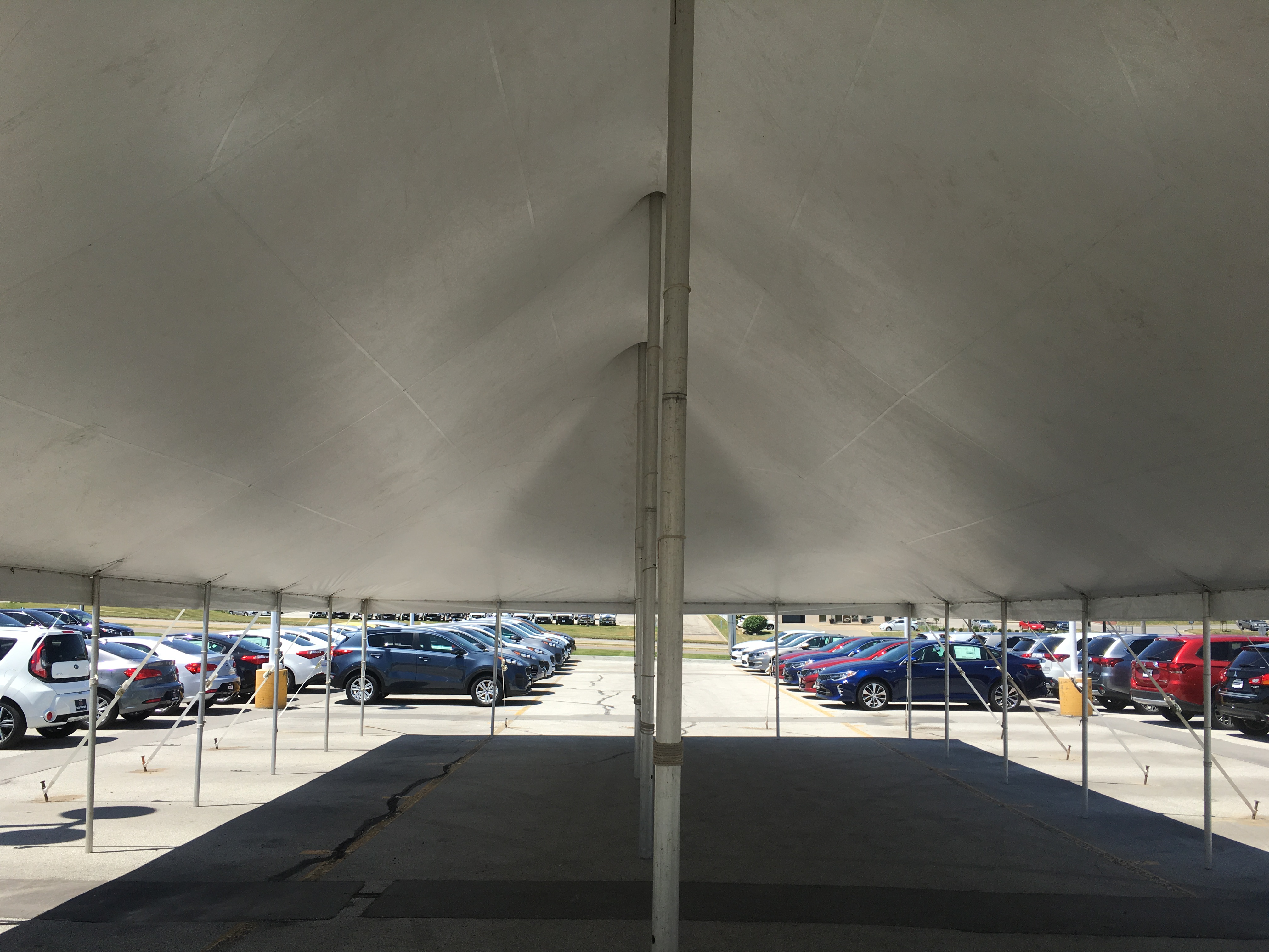 Under the rope and pole tent setup for Kia Motor dealership tent sale