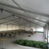 Inside the 60' x 131' Clearspan tent for the grand opening event of Brownells location in Grinnell, Iowa with French and regular sidewalls