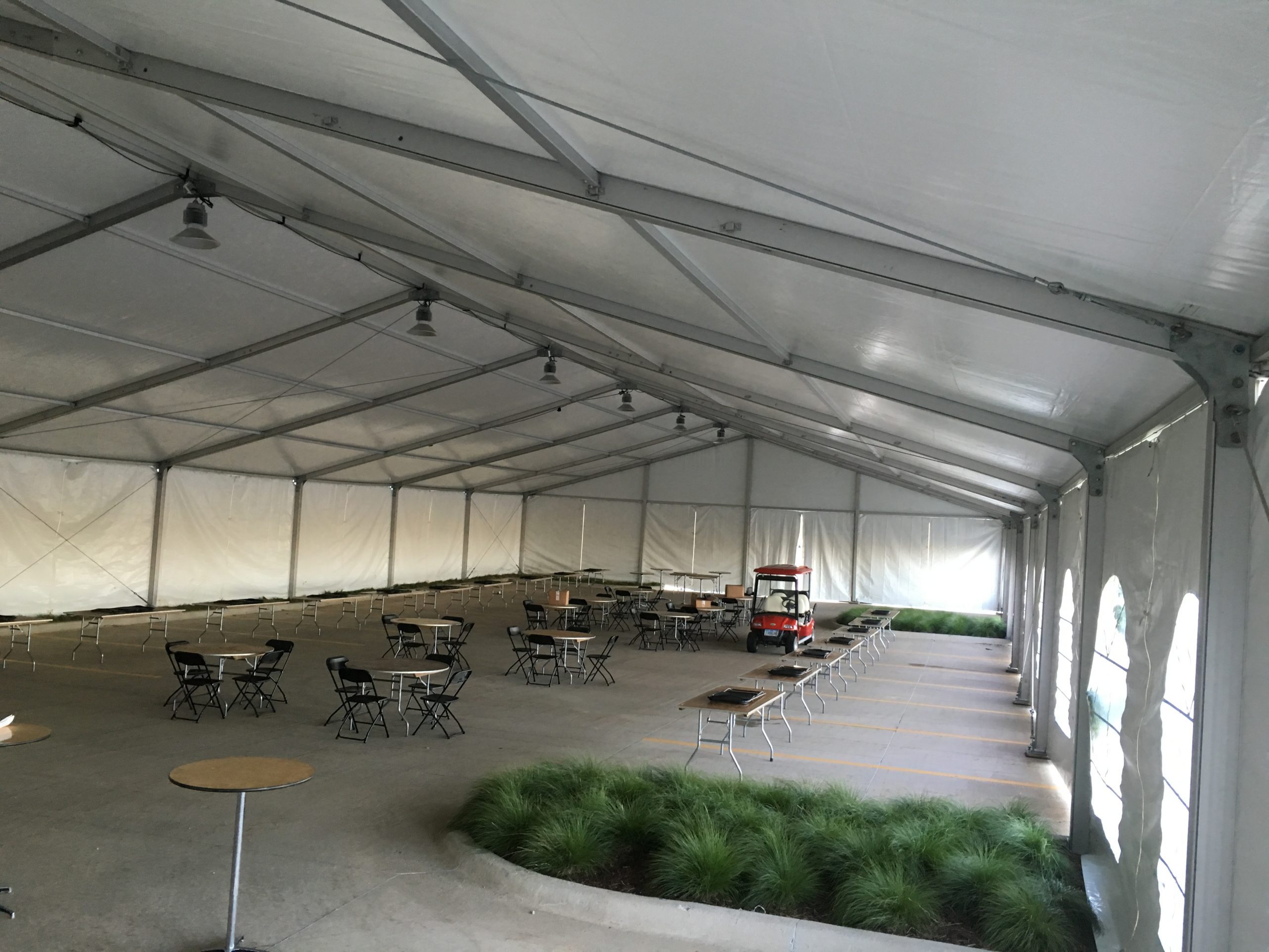 Inside the 60' x 131' Clearspan tent for the grand opening event of Brownells location in Grinnell, Iowa with French and regular sidewalls
