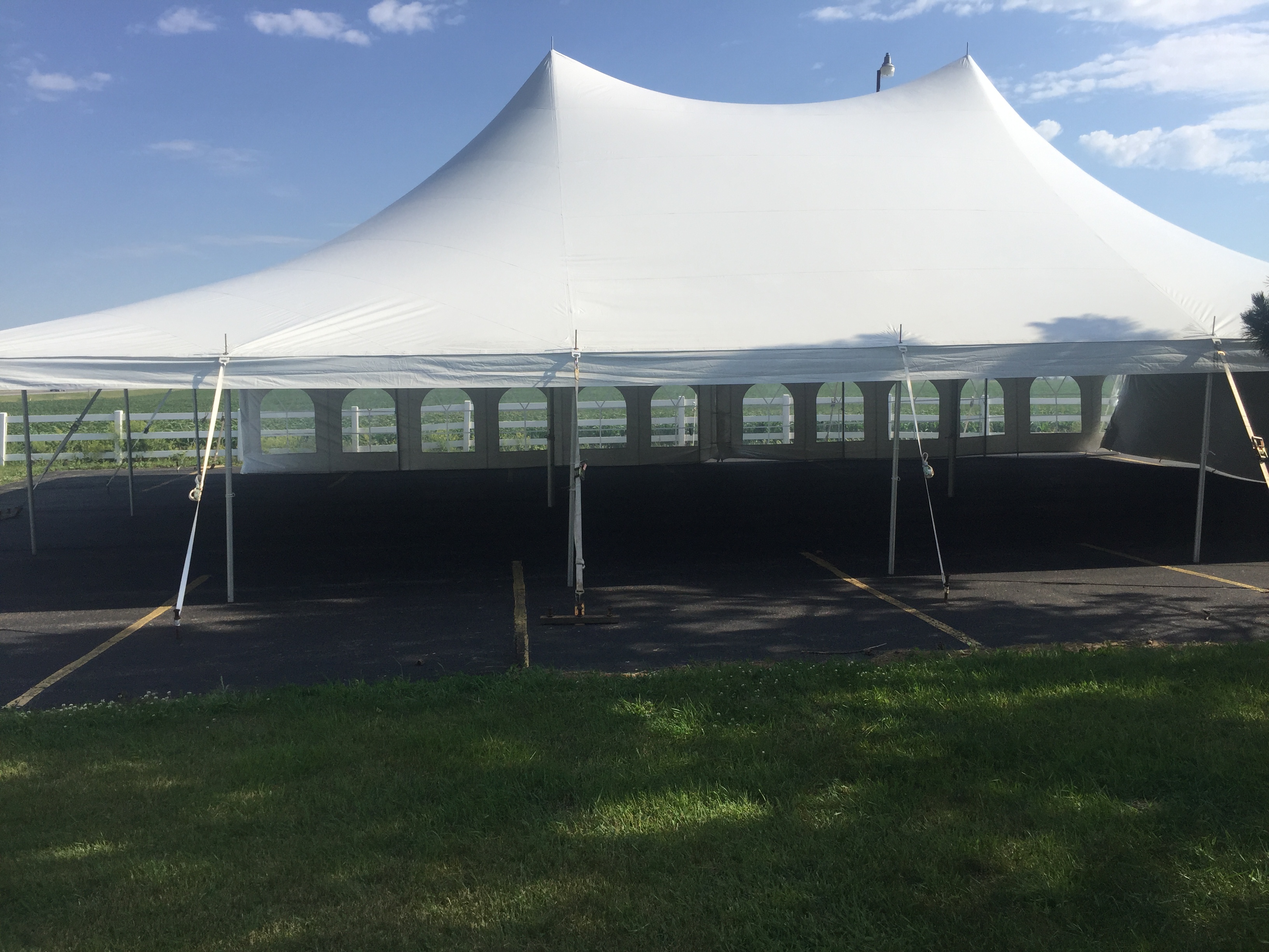 Closeup of 40' x 60' rope and pole wedding tent at church in Grinnell, Iowa