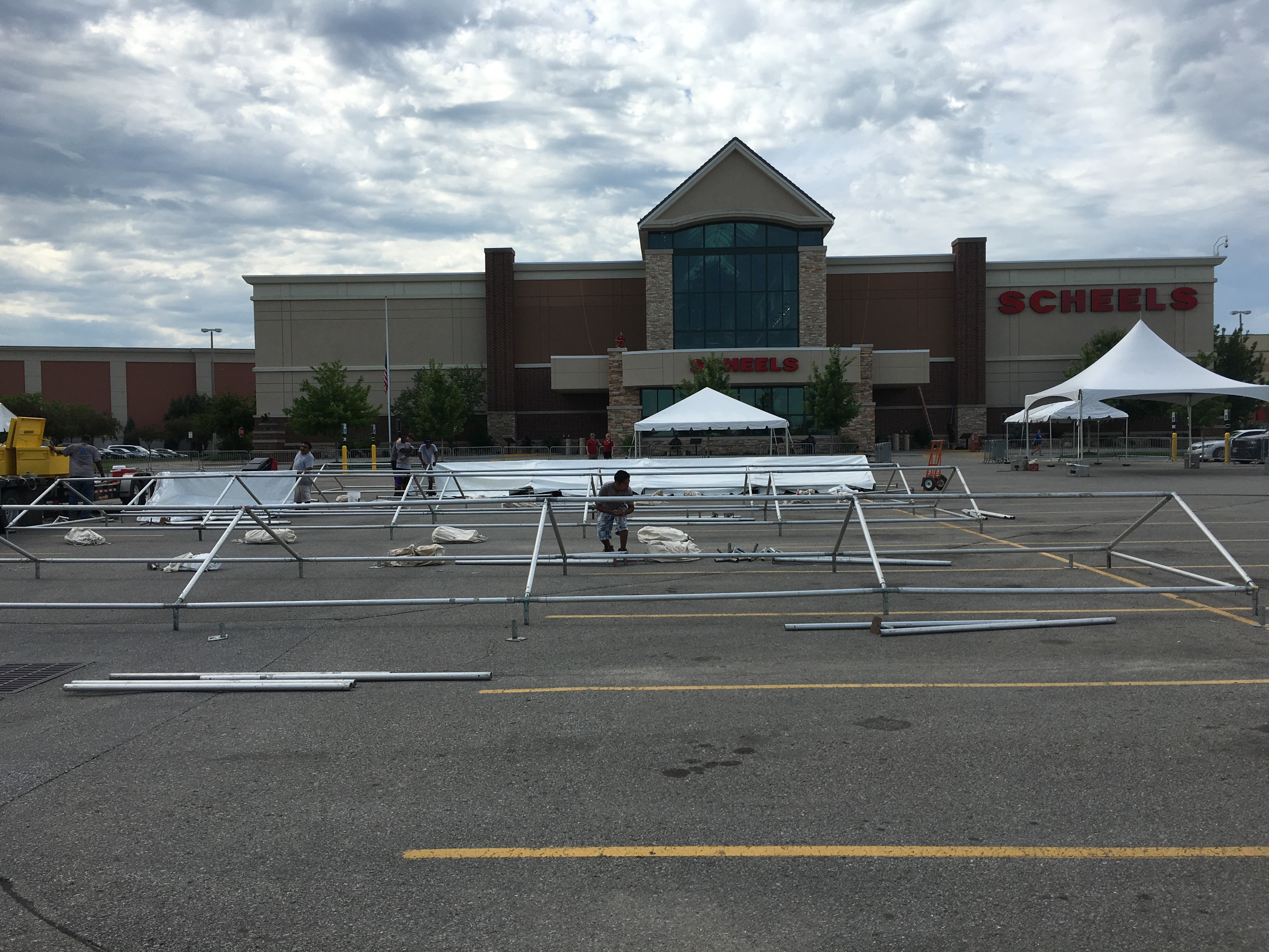 Setting up frame tents at Scheels in Des Moines, Iowa