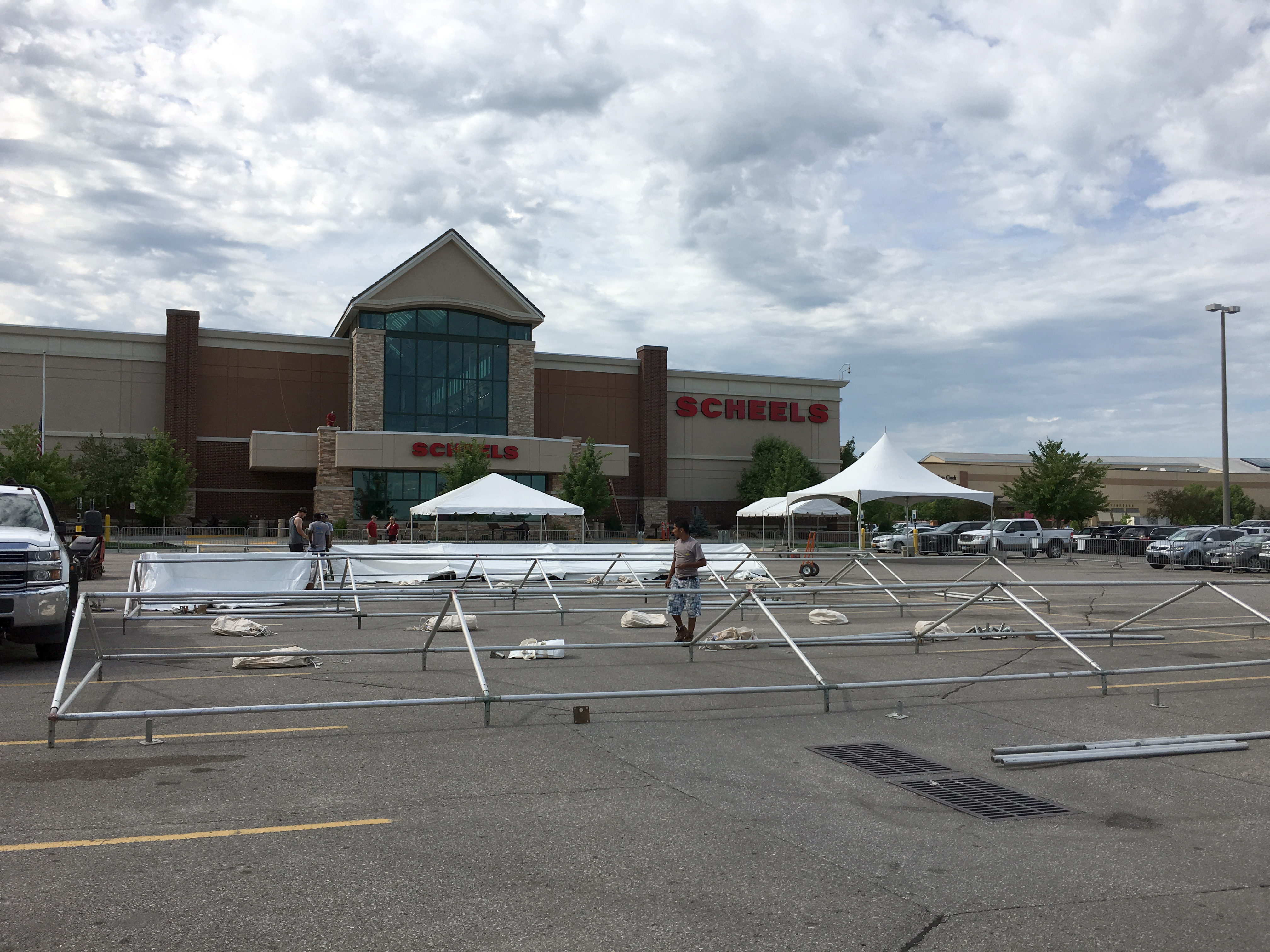 Setting up frame tents at Scheels in Des Moines, Iowa