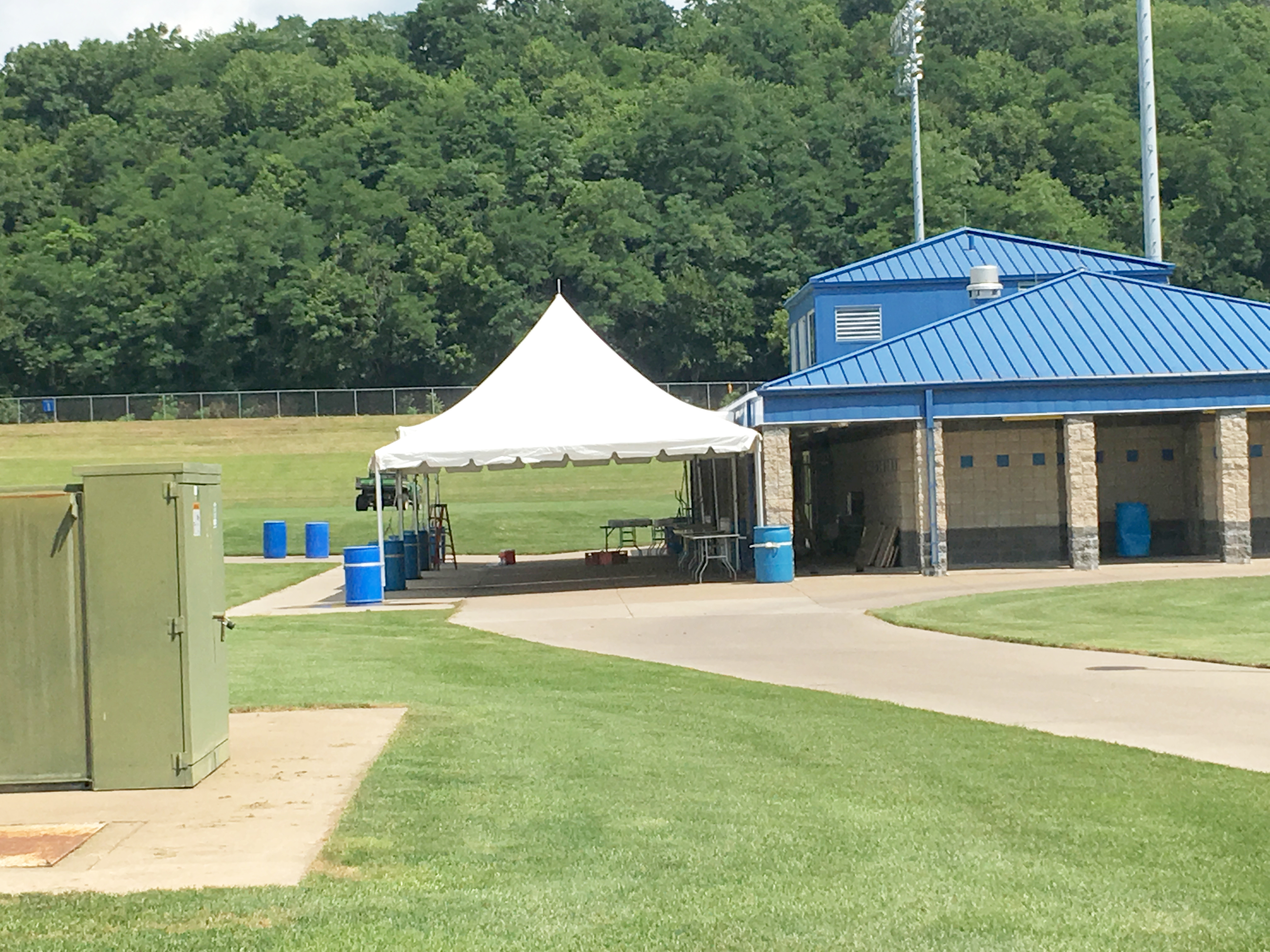 Frame tent with water barrels as ballast at the Muscatine Soccer Complex