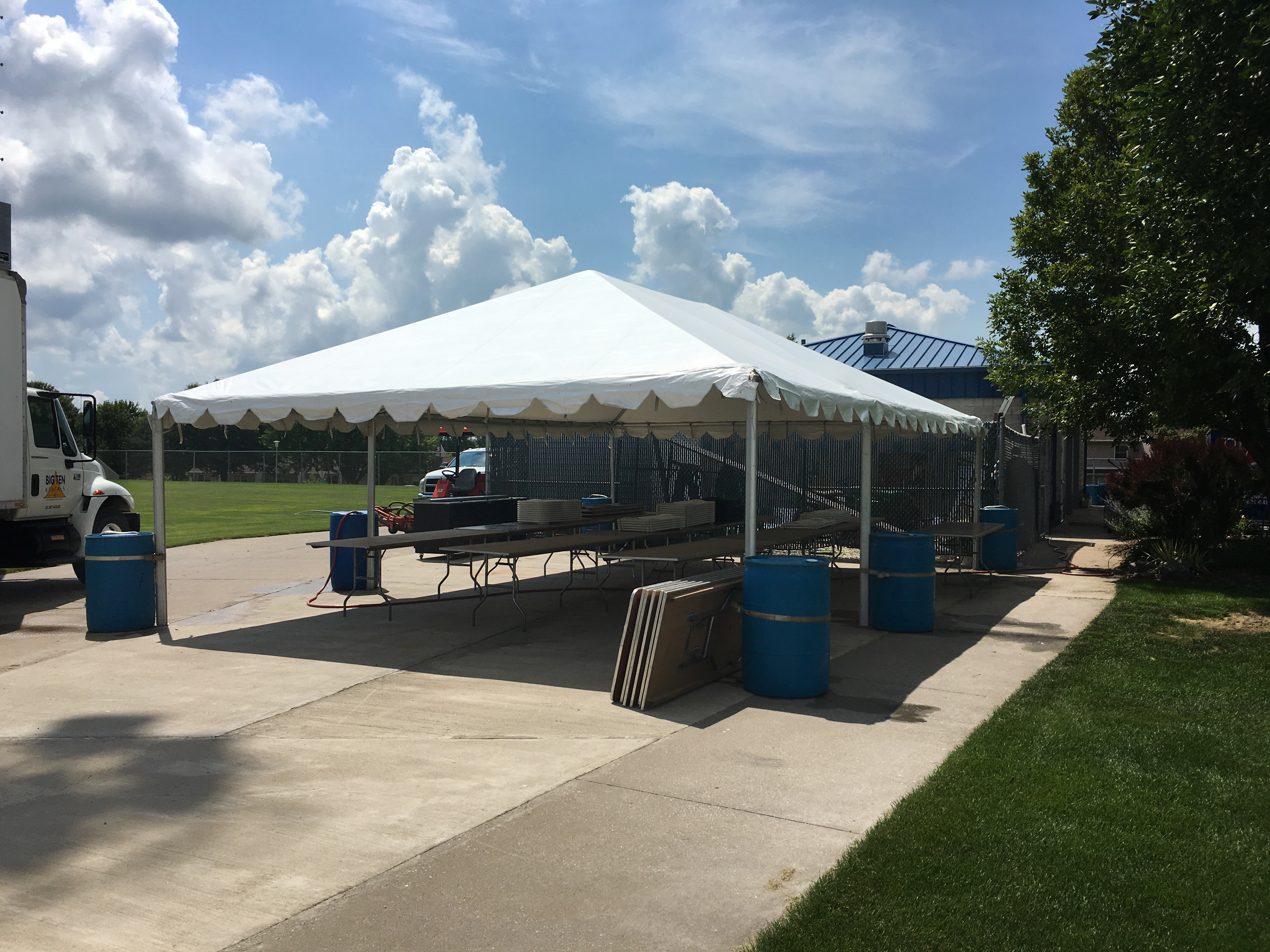 Frame tent with water barrels at the Muscatine Soccer Complex