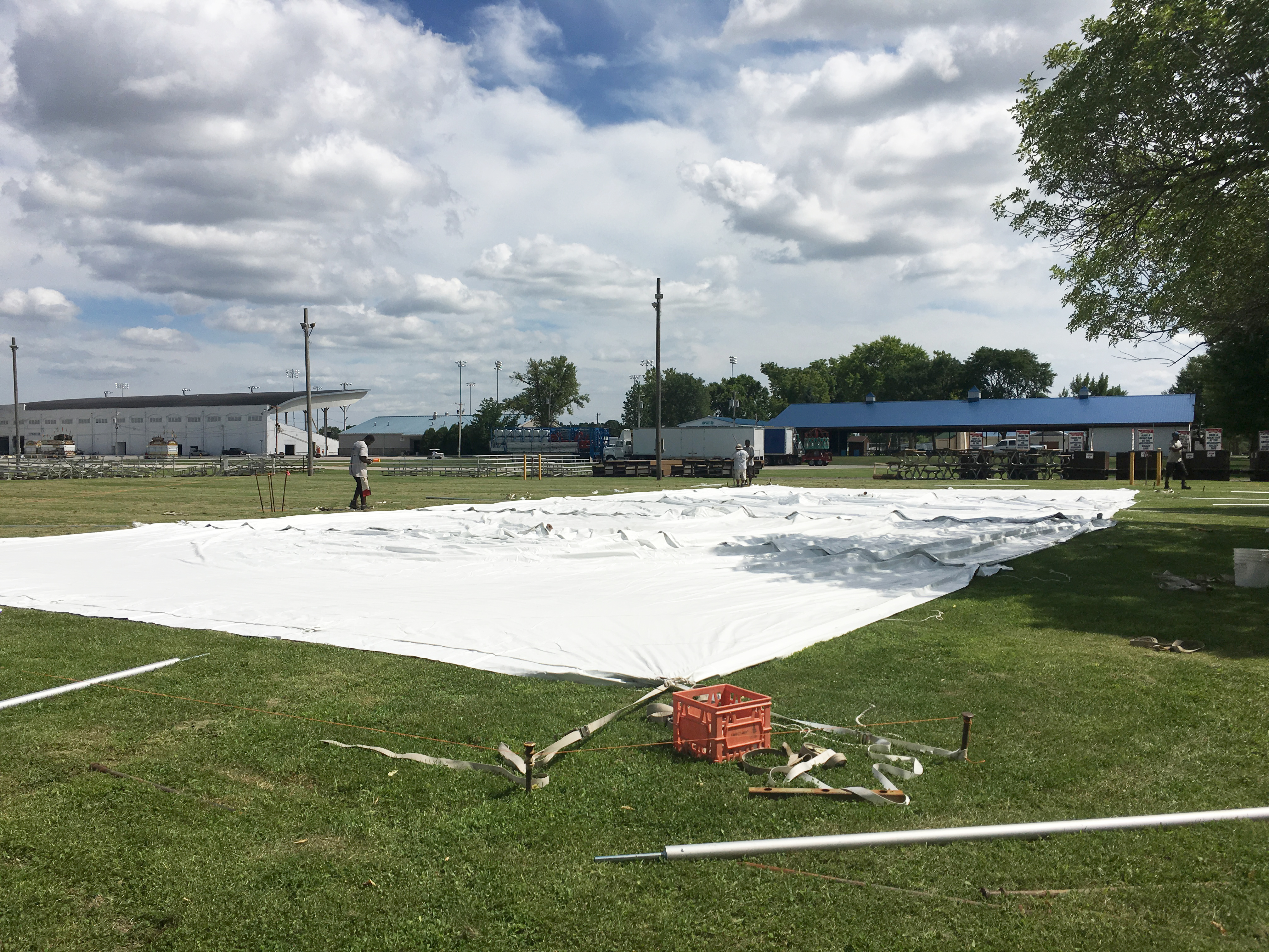 Laying out a rope and pole tent with stakes at the Mississippi Valley Fair 2016