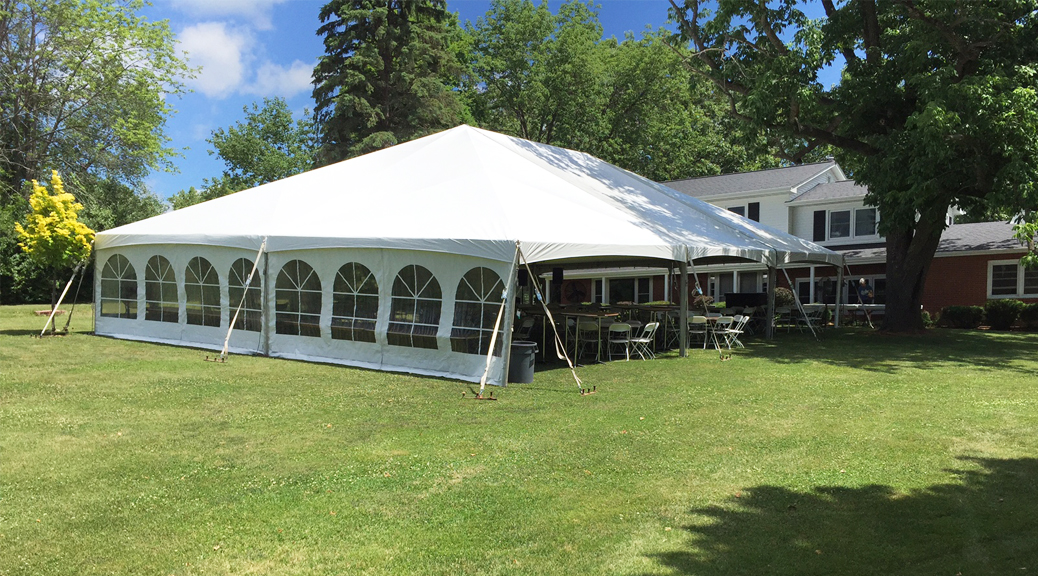 Outdoor wedding reception with 40' x 60' hybrid tent