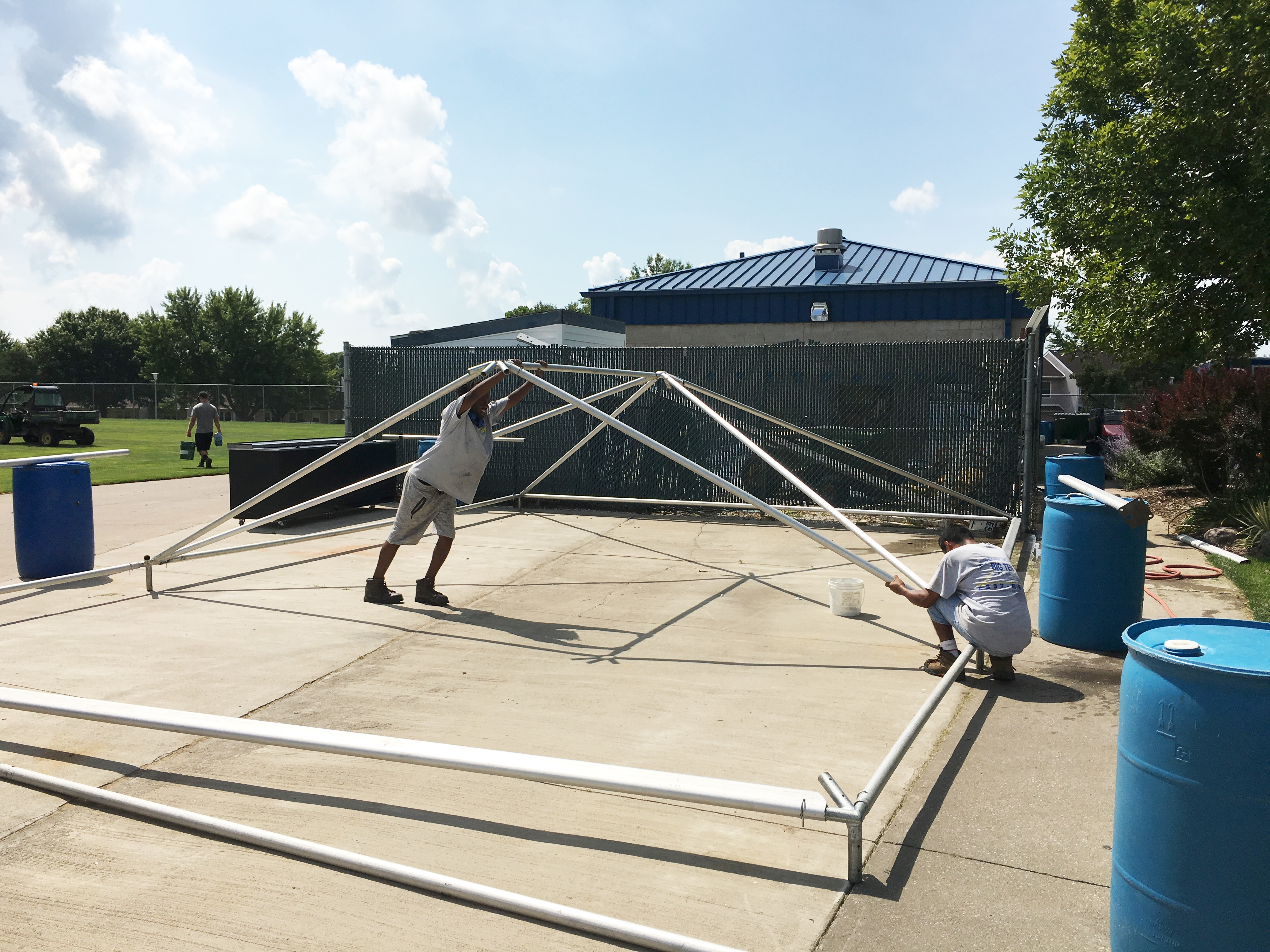 Putting the frame portion of a frame tent together at the Muscatine Soccer Complex