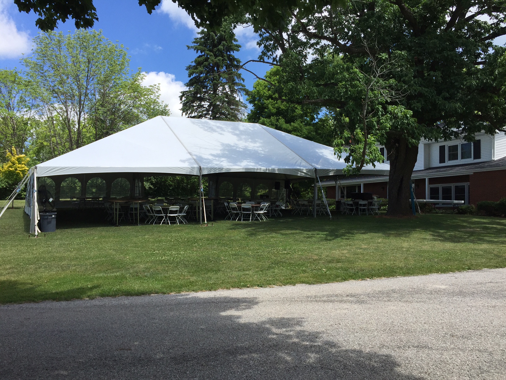Side of 40' x 60' hybrid tent used for an outdoor wedding reception