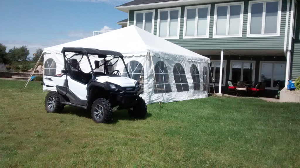 20' x 20' frame tent with black and white checked dance flooring for 50s style anniversary party