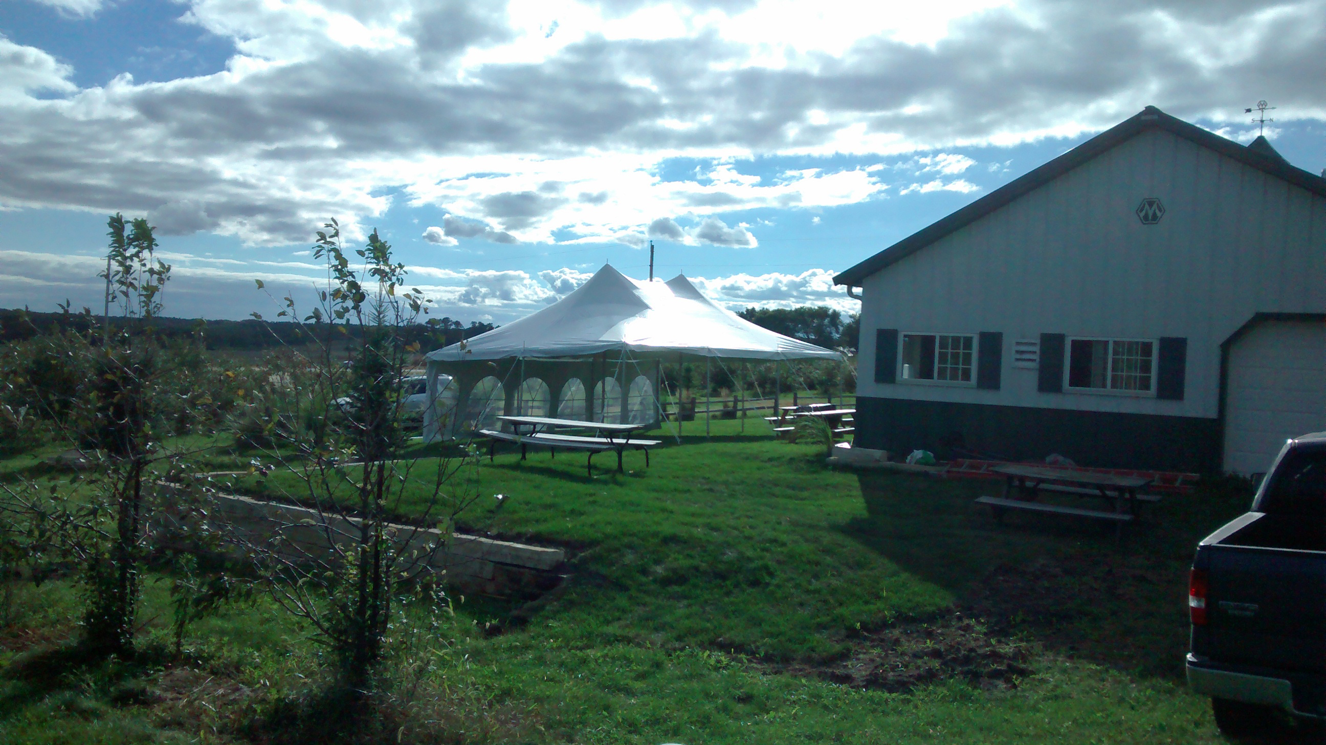 20' x 30' rope and pole tent with French window sidewalls at The Big Apple Orchard Mt Vernon, IA