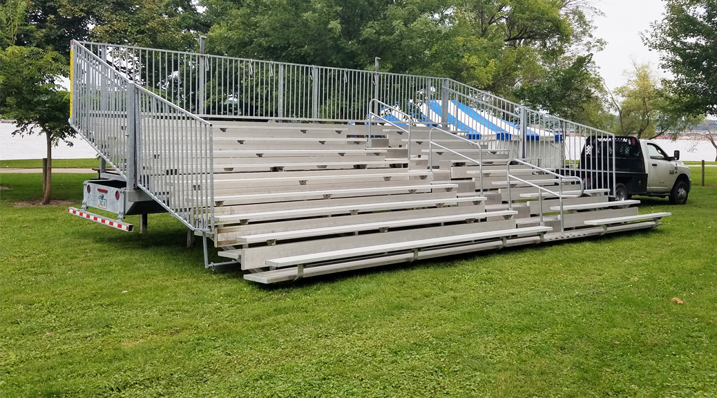 30' 10 Row Hydraulic bleachers at a political event for Hillary Clinton at Illiniwek Campground in Hampton, IL