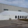 30' x 75' frame tent with 2' x 2' x 2' bunker blocks and sidewall at Brownells in Grinnell, Iowa