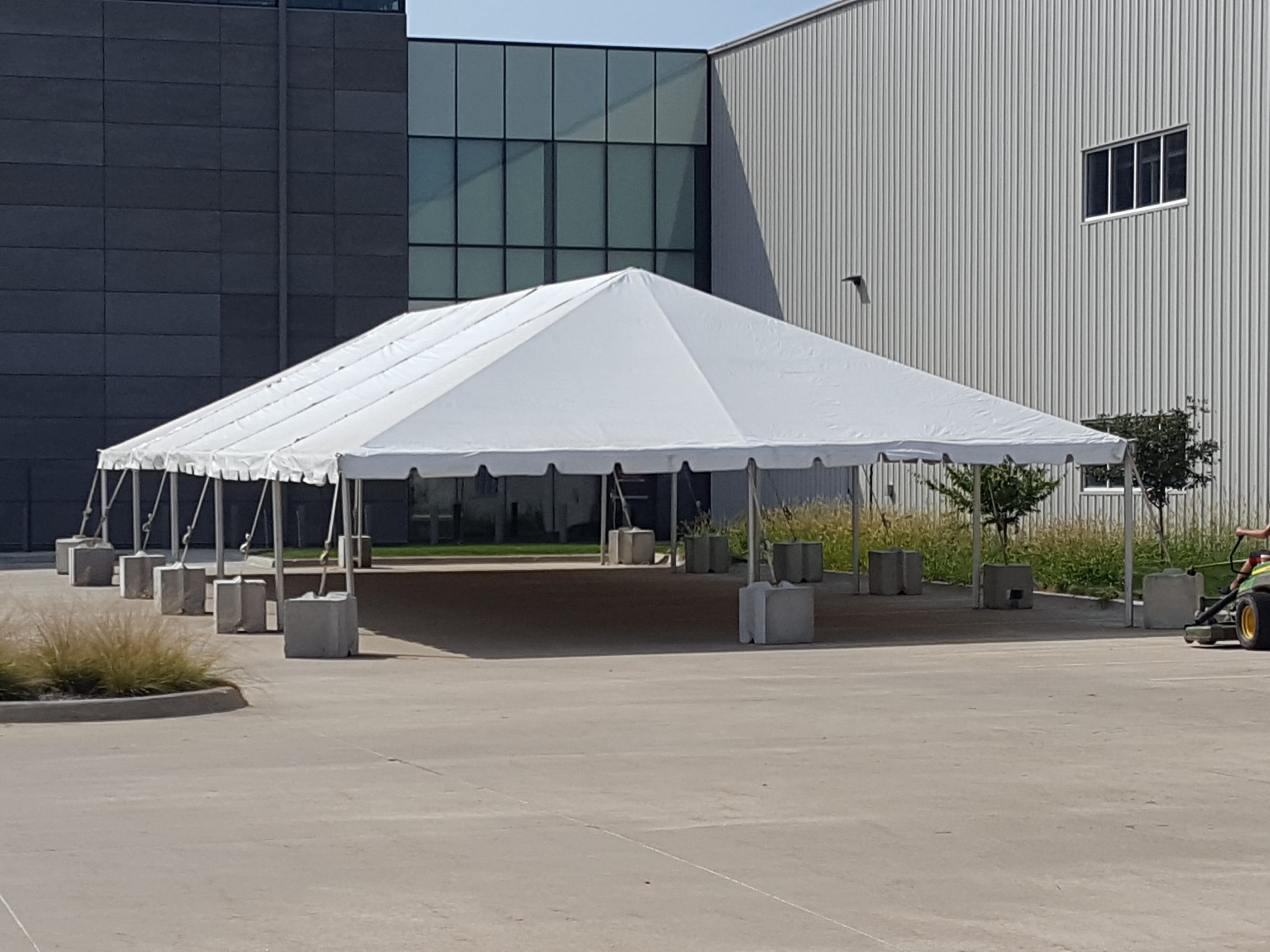 30' x 75' frame tent without sidewall with 2' x 2' x 2' bunker blocks at Brownells in Grinnell, Iowa