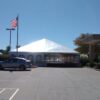 40' x 100' hybrid tent setup in parking lot with 2' x 2' x 2' blocks