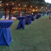 Blue tables outside of the 60' x 90' rope and pole wedding tent