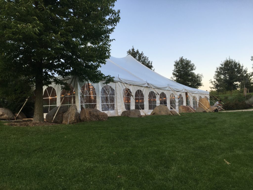 Corner of 40' x 60' white rope and pole wedding tent at Harvest Preserve