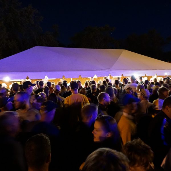 Crowd in front of 20' x 40' frame beer tent at FRYfest block party