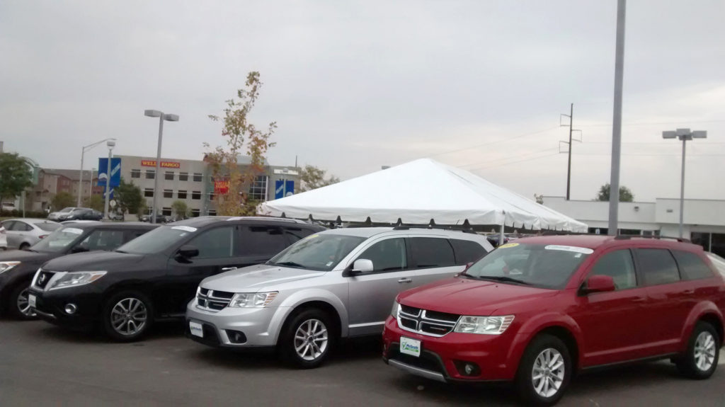 End of 20' x 30' frame tent for the grand re-opening at Coralville Used Car Superstore