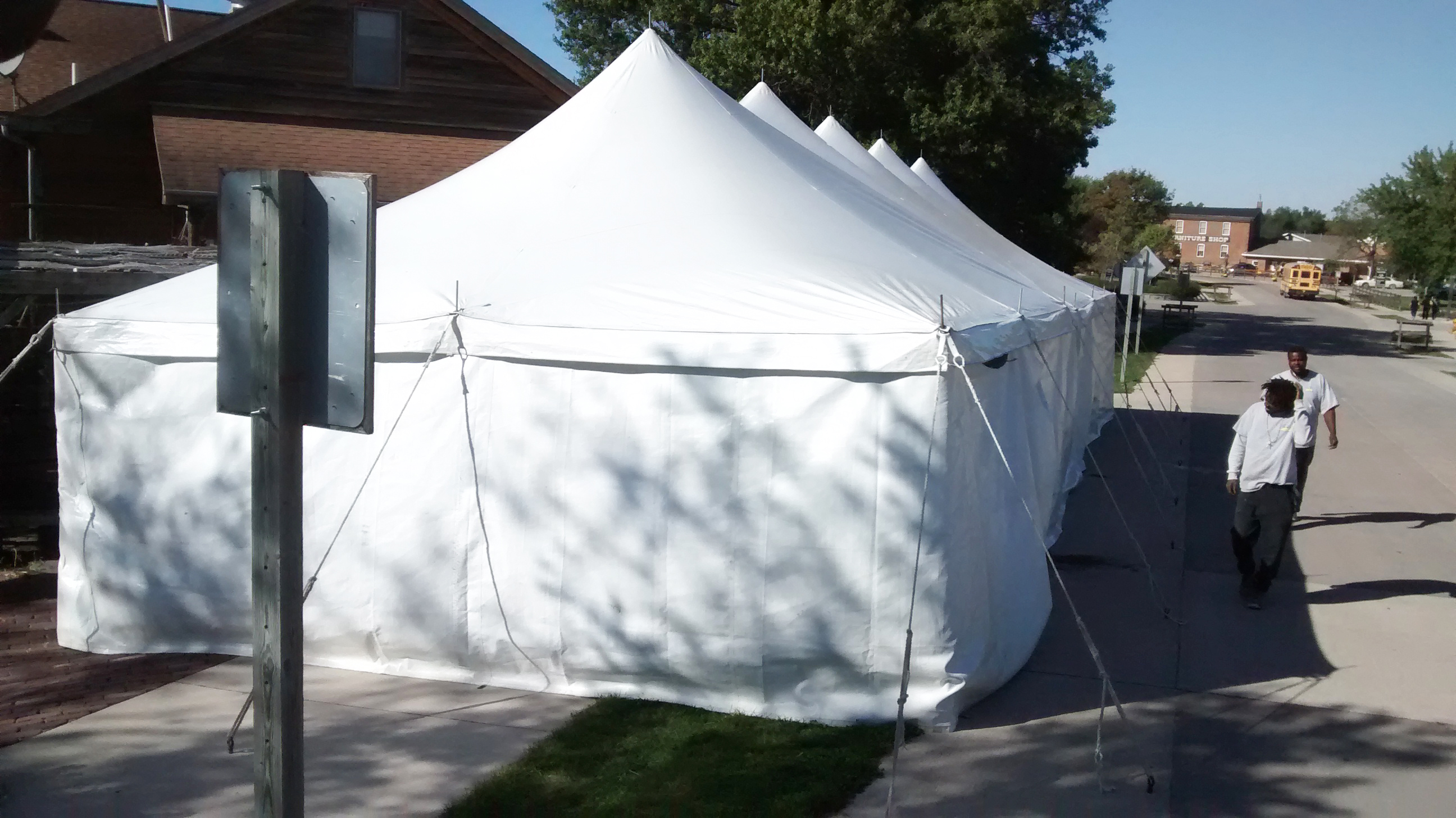 End of 20' x 60' rope and pole tent with sidewall at Millstream Brewing Company in Amana, IA with crew guys
