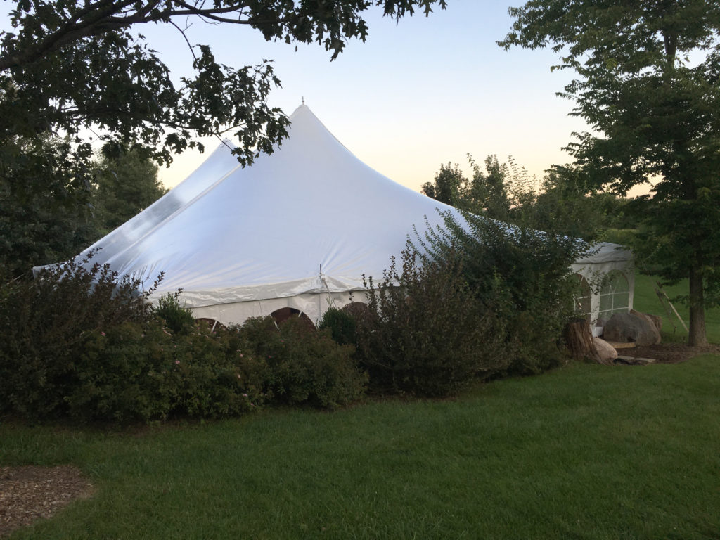 End of 40' x 60' white rope and pole wedding tent at Harvest Preserve