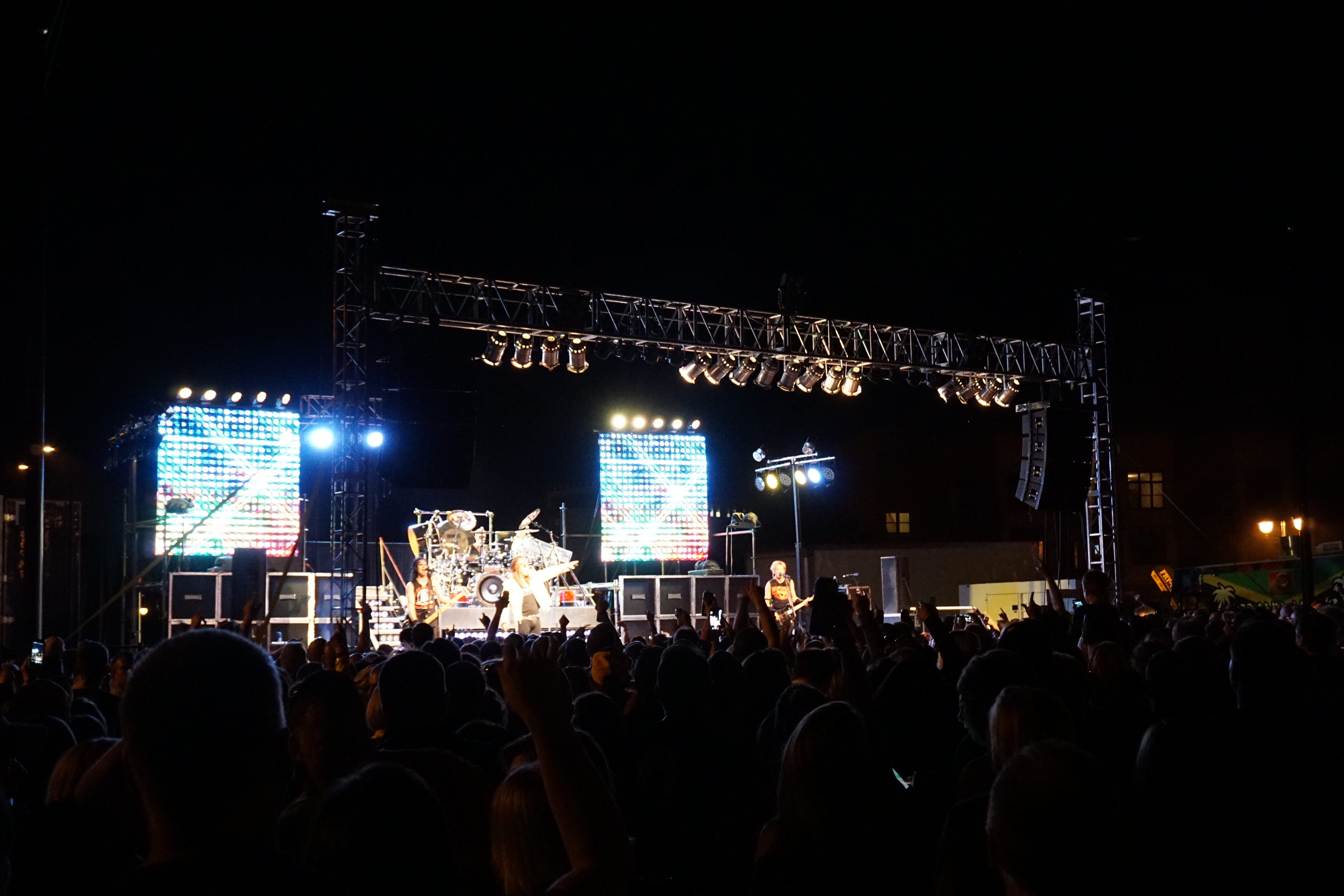 Full stage of Hairball cover band playing on stage at FRYfest block party