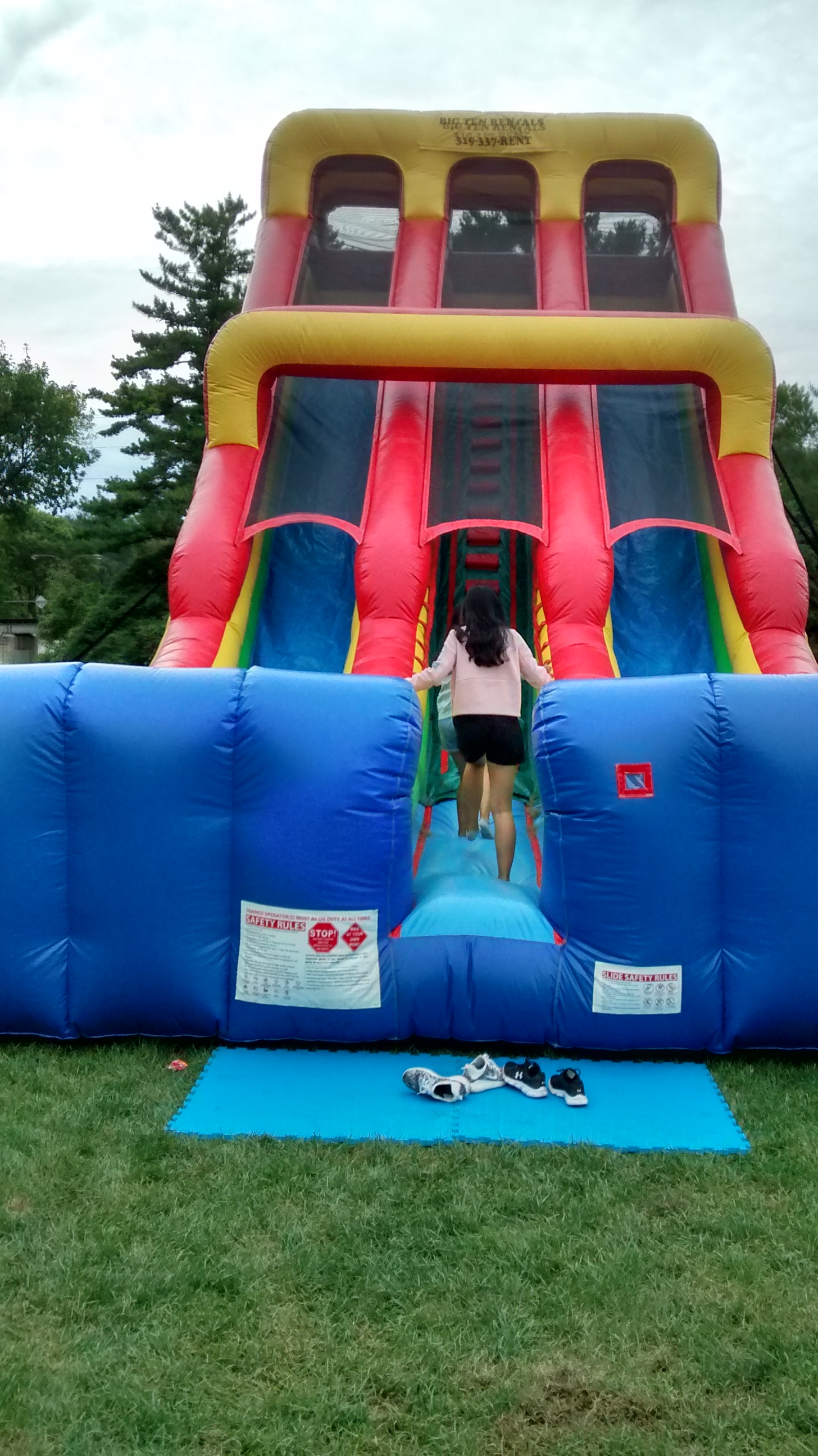 Making the climb on the 24 inflatable slide at University 