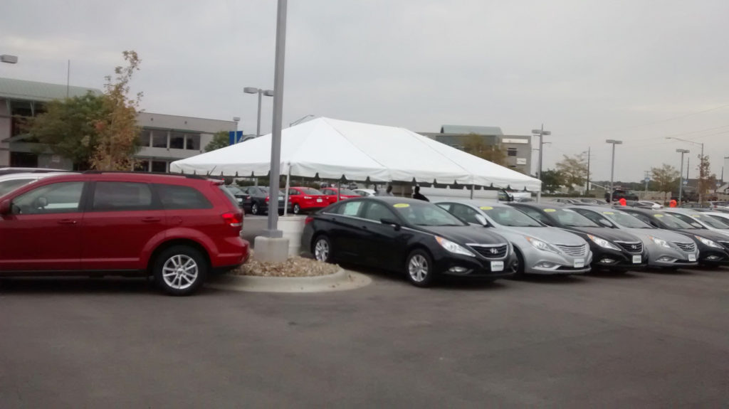 Side of 20' x 30' frame tent for the grand re-opening at Coralville Used Car Superstore