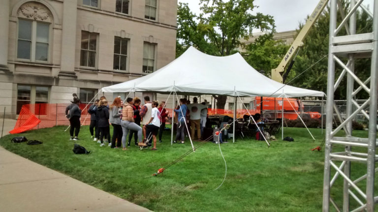 Students under our 20' x 30' rope and pole tent set up for SCOPE Productions: University of Iowa
