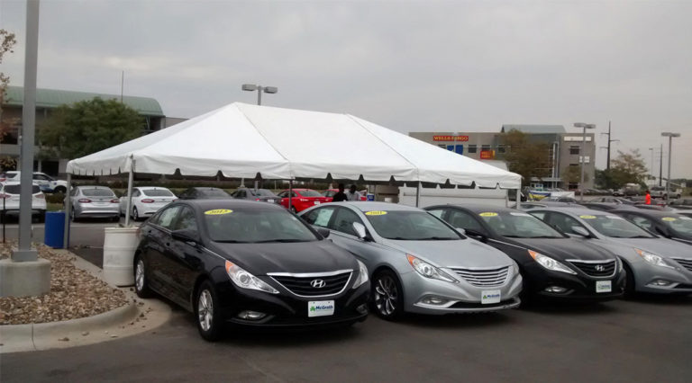 Tent for the grand re-opening at Coralville Used Car Superstore