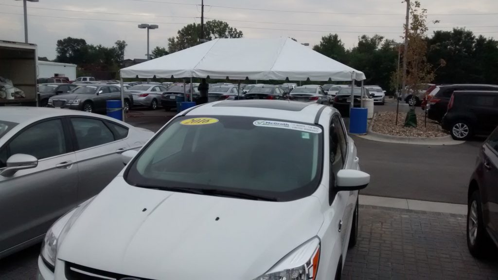 View by cars at 20' x 30' frame tent for the grand re-opening at Coralville Used Car Superstore