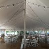 40' x 60' rope and pole tent with cafe lights, tables, chairs and popcorn machine