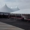 60' x 90' rope and pole tent and 20' x 30' frame tent with tables for Morris & Company Entertainment in Davenport, Iowa