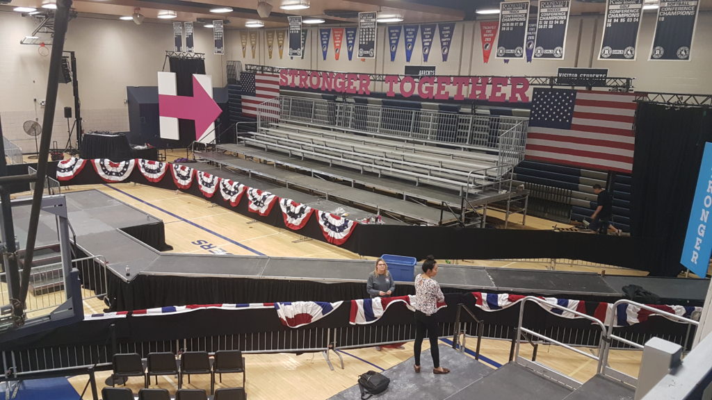 Elevated stage and catwalk with 45 degree turn for Hillary Clinton political rally in Des Moines at Pomerantz Gymnasium