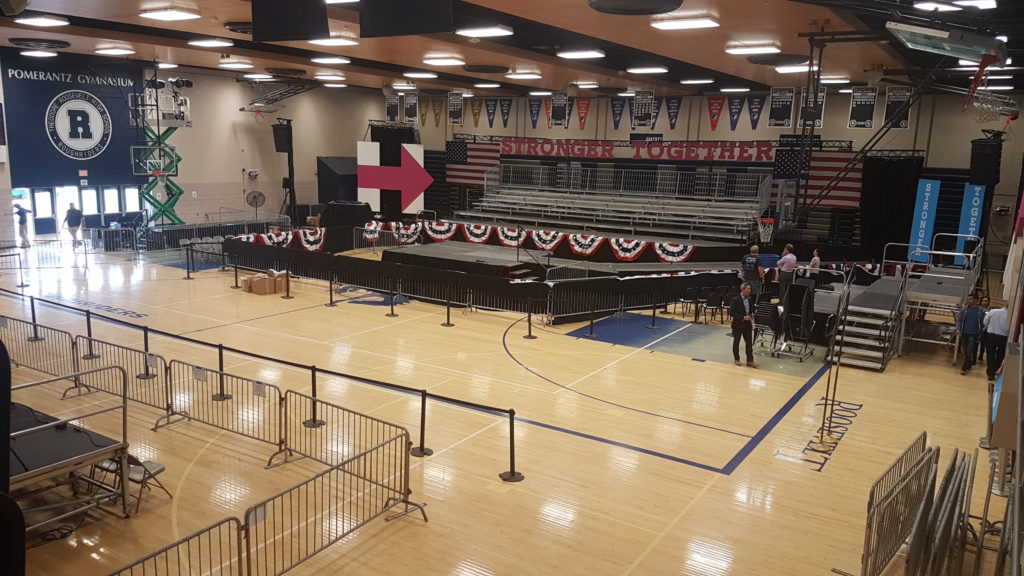 Event setup for Hillary Clinton political rally in Des Moines at Pomerantz Gymnasium