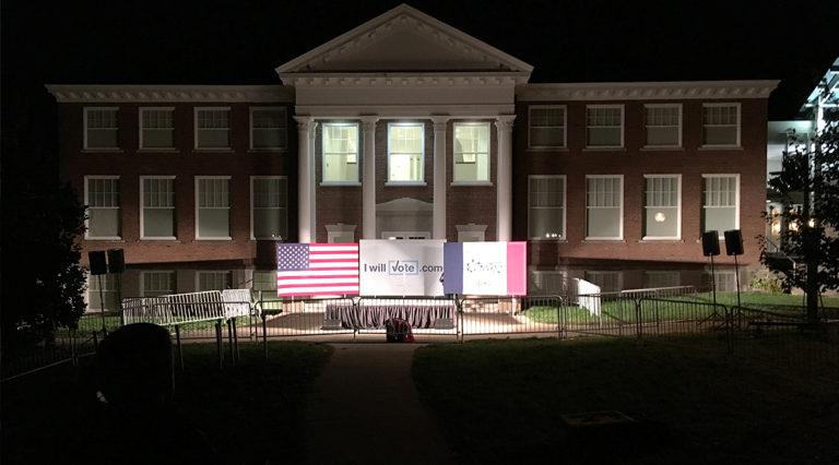 Political rally event setup for Bill Clinton in front of Armstrong Hall at Cornell College