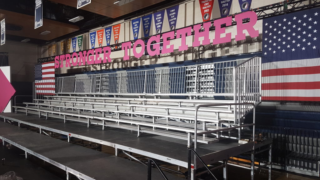 Setup of several 5-row elevated bleacher for Hillary Clinton political rally event