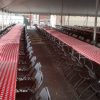 Under the 60' x 90' rope and pole tent with tables for Morris & Company Entertainment in Davenport, Iowa