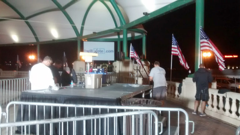 Stage with flags for political event at Larsen Park Road, Sioux City, Iowa