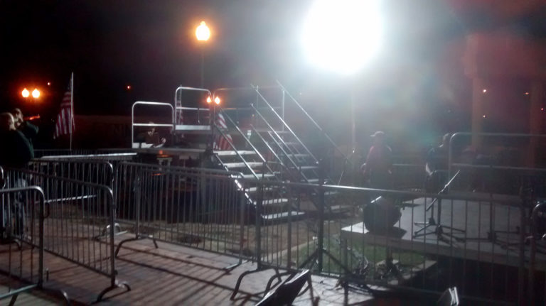 Two levels of press risers with stairs setup for political event at Larsen Park Road, Sioux City, Iowa