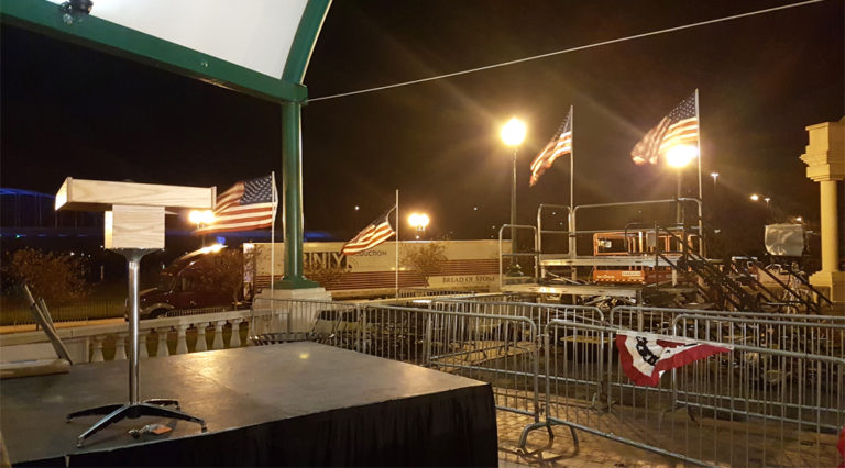 We setup the podium, stage, barricade and in the background press risers with stairs for this political event at Larsen Park, Sioux City, Iowa