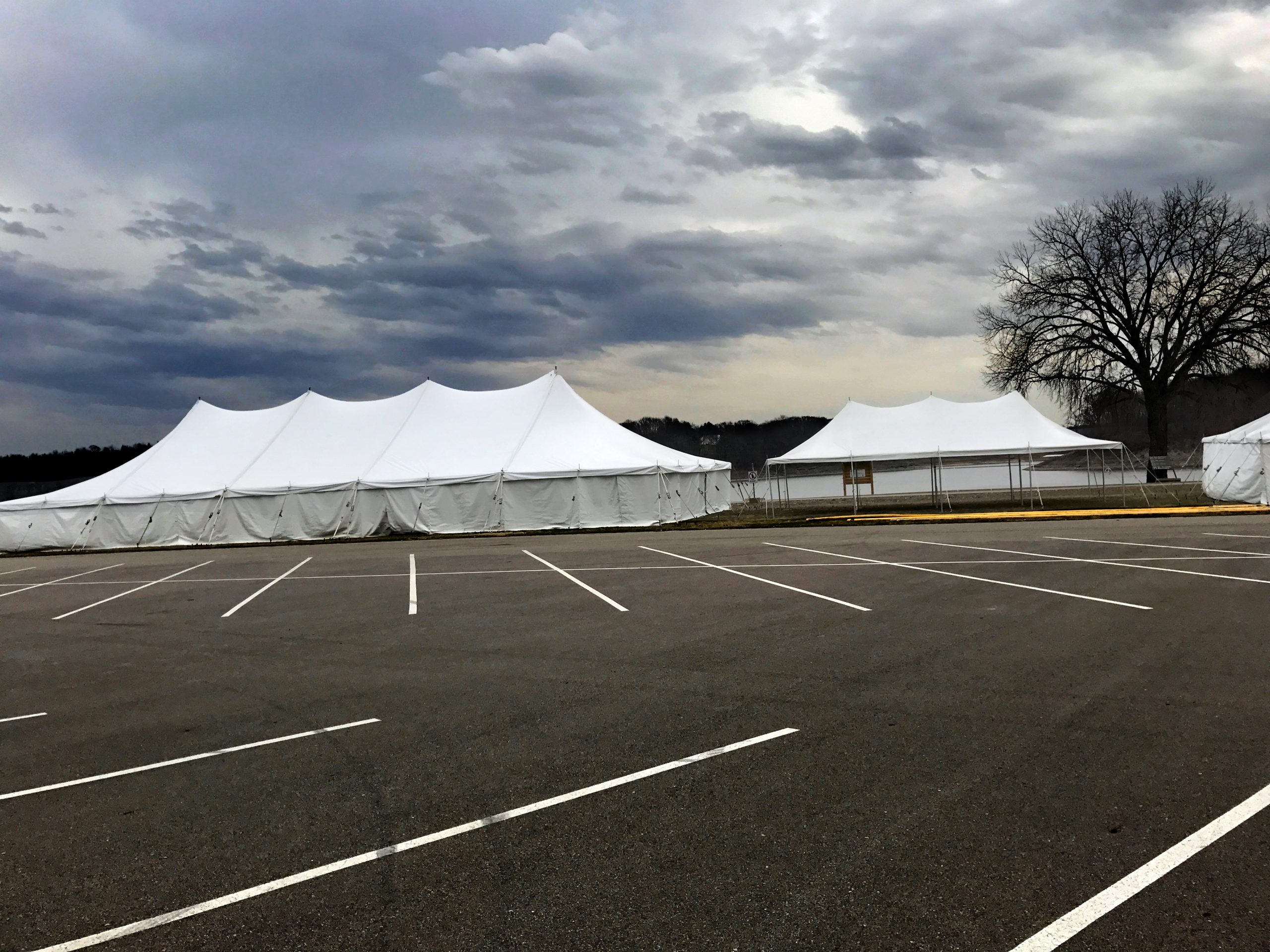 40' x 100' Elite rope and pole tent (left), 20' x 40' rope and pole tent (middle), 30' x 60' rope and pole tent (right) for Special Olympics Polar Plunge