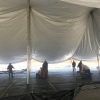 Setting up a 80' x 120' rope and pole tent at Kelly's Irish Pub for Saint Patrick's Day 2017 in Davenport, Iowa