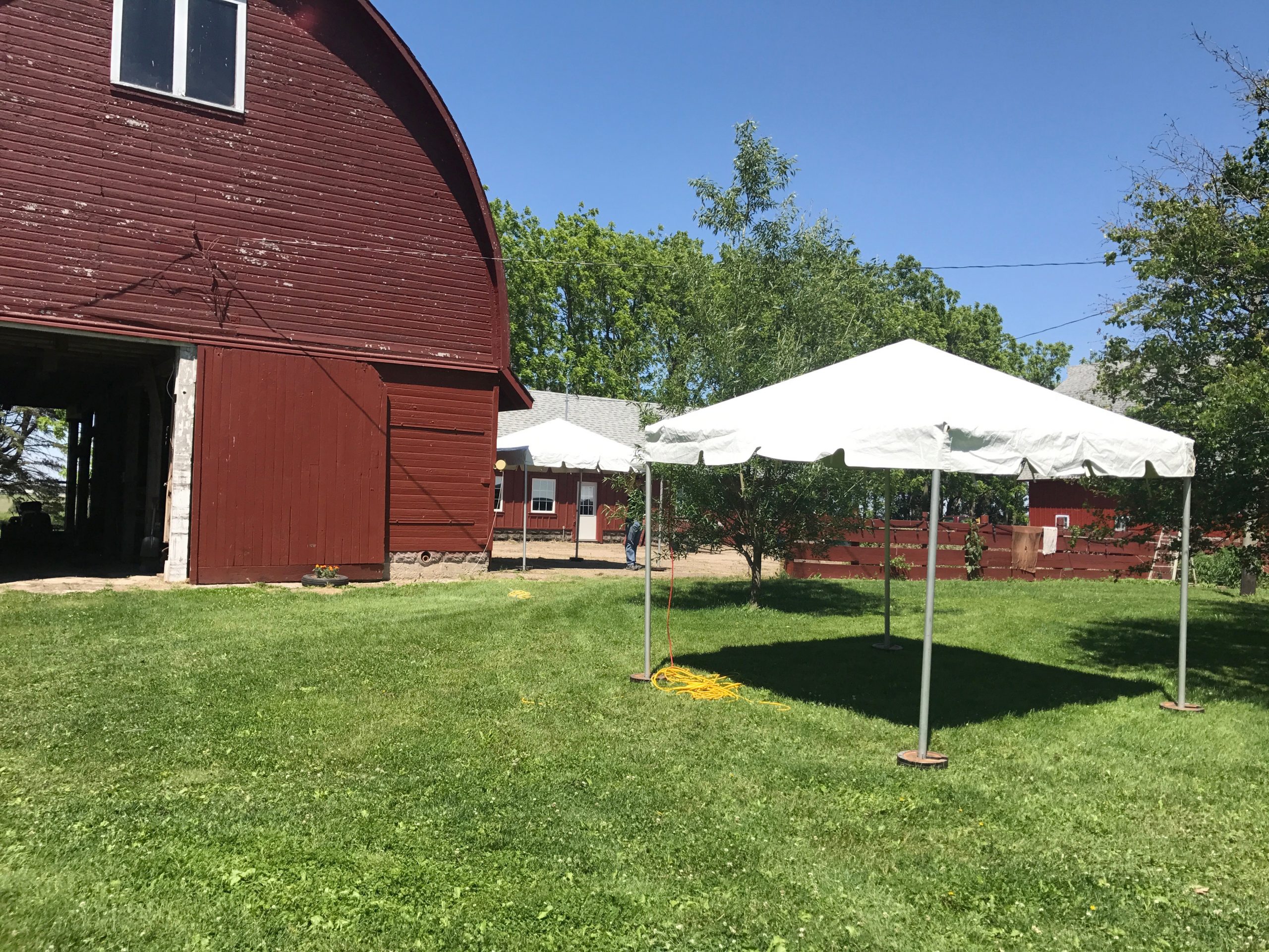 10' x 10' frame tent by a red barn in New Liberty Road, Walcott, IA